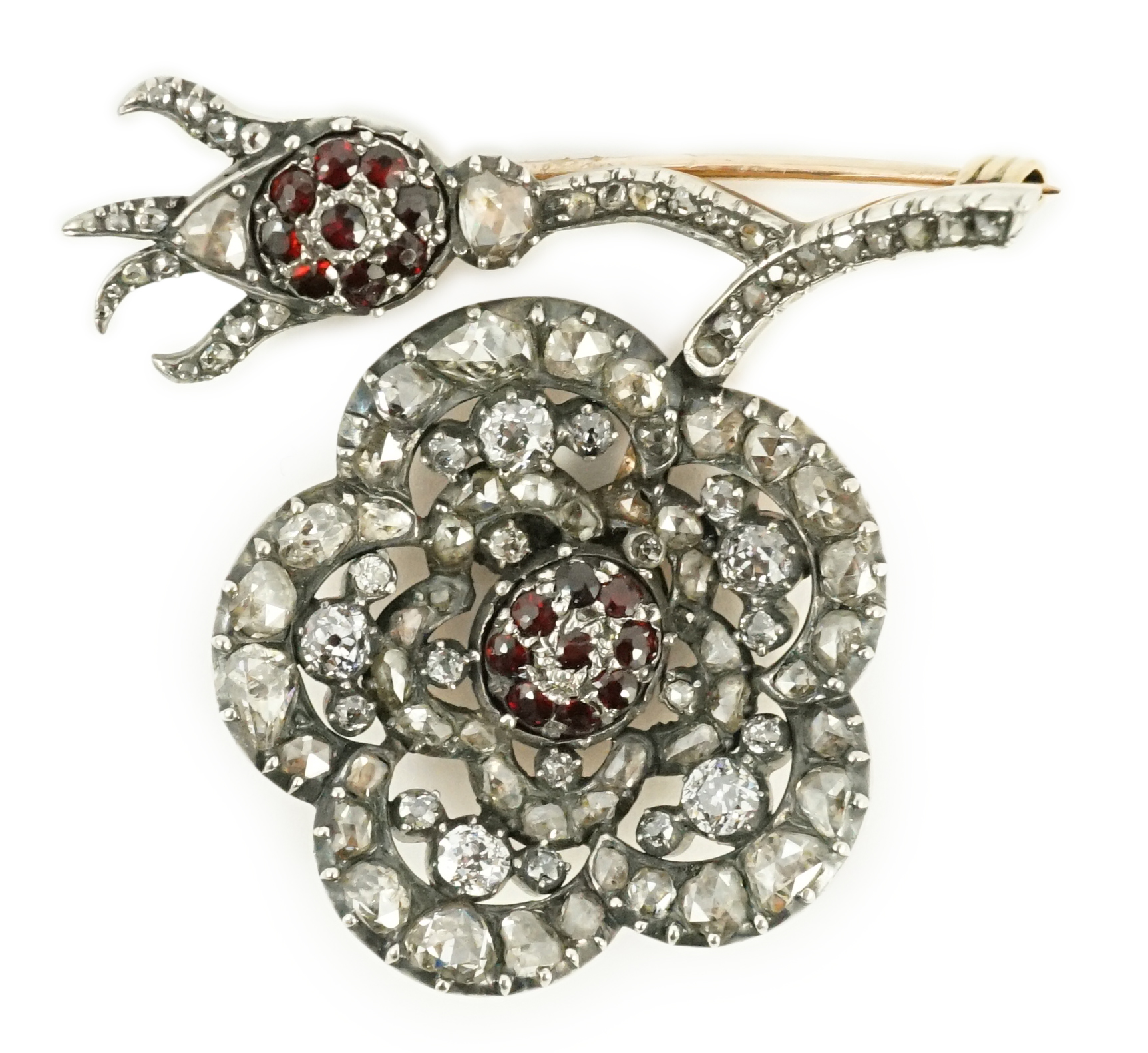 A Victorian, gold and silver, old and rose cut diamond and garnet cluster set pansy brooch